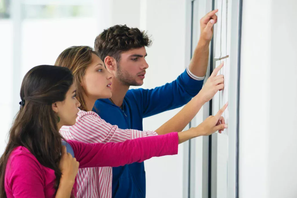 students checking on list