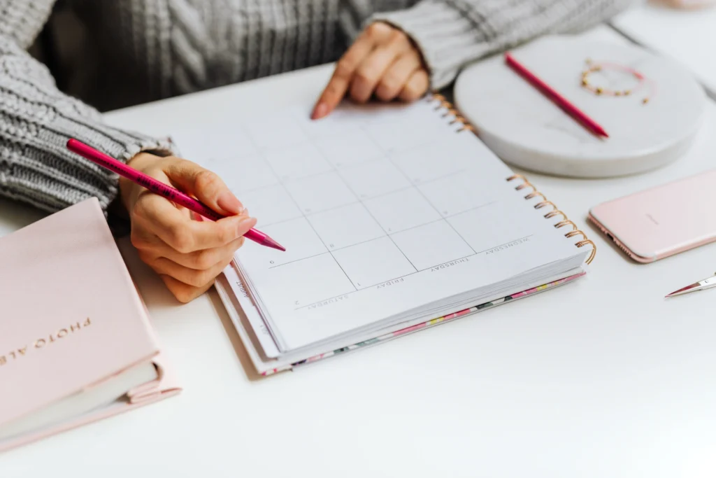 creative woman planning her week in calendar feminine style picjumbo com